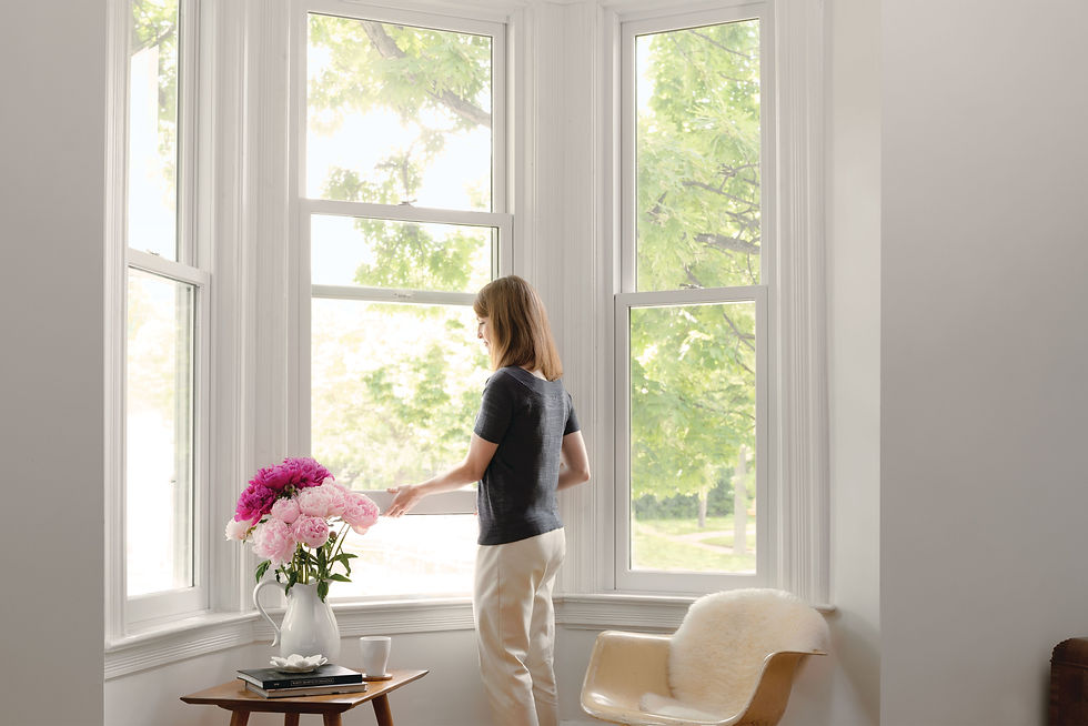 Marvin bay window projecting from a traditional home exterior with window seat visible inside