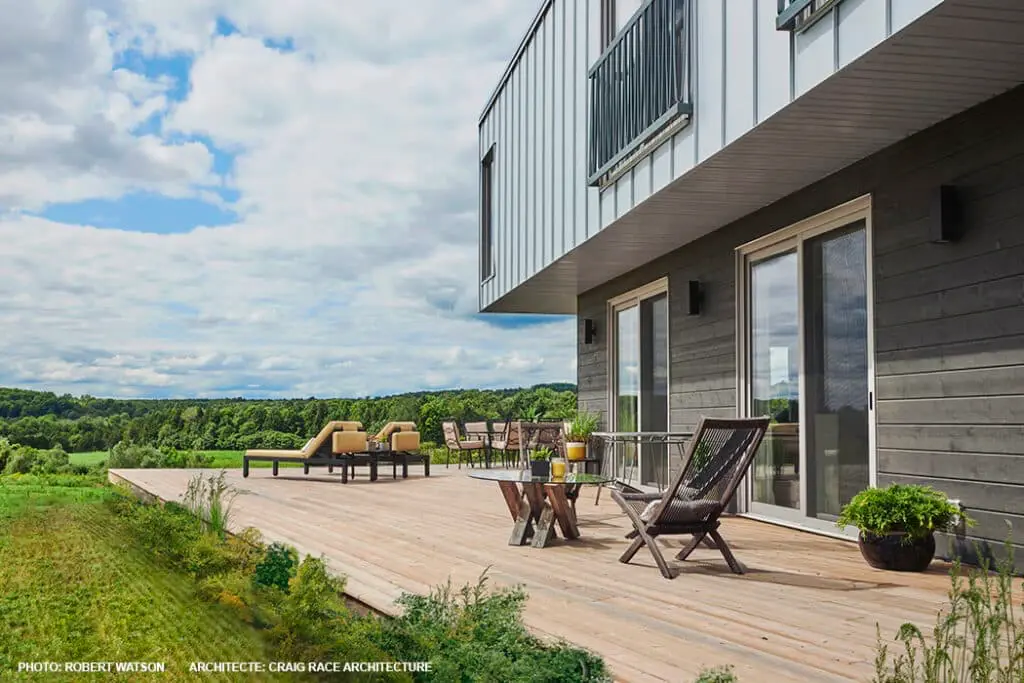 Maibec Wood Siding at modern home combined with metal vertical seam siding