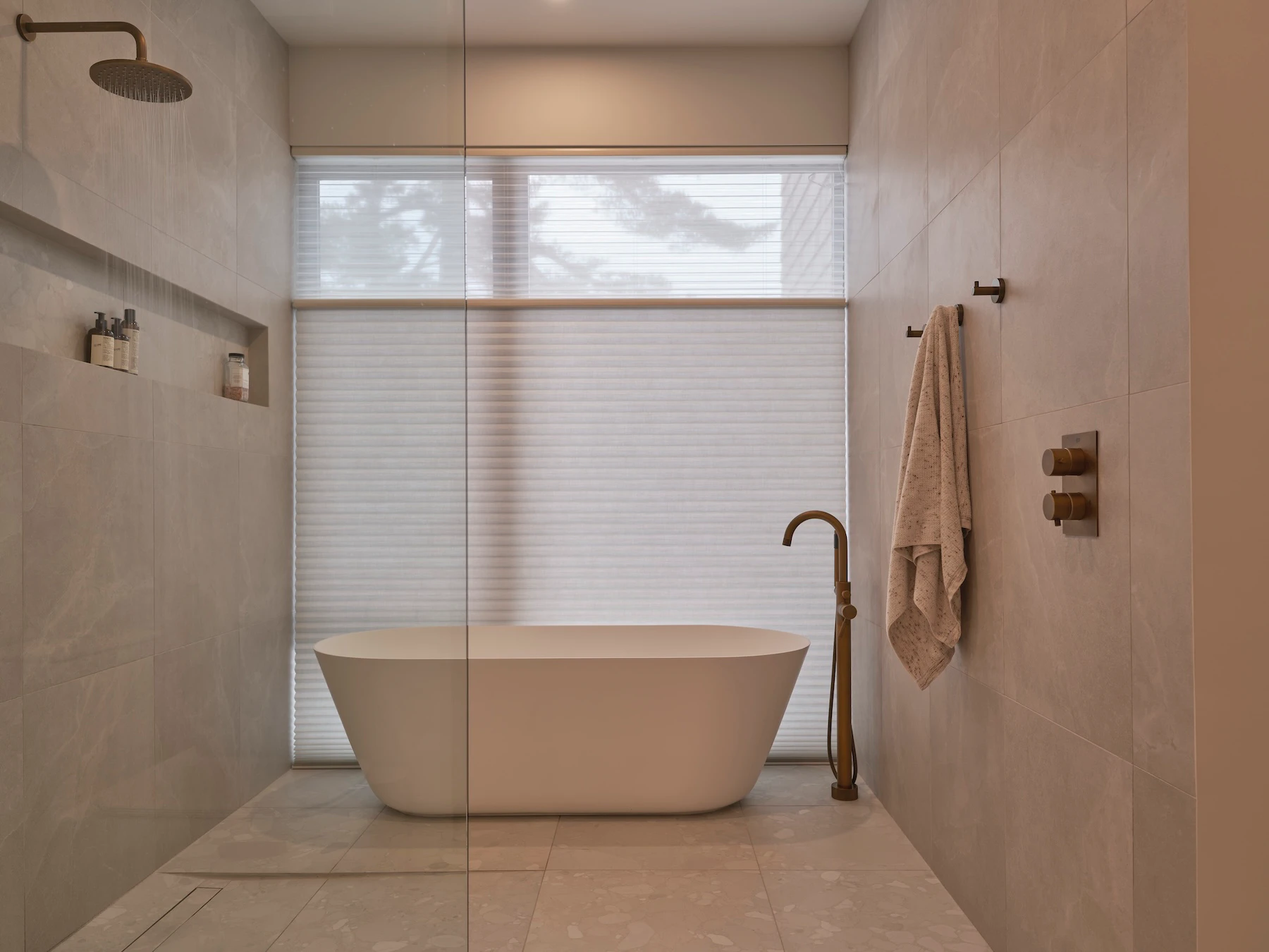 Sunnybrook sanctuary custom home interior bathtub placed inside a wet room, set in front of a large shaded privacy window