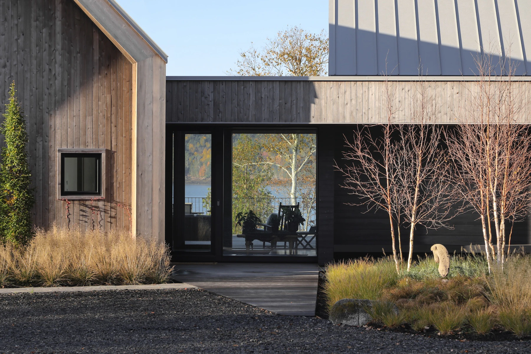 Main entry door with sightline through to the river through Marvin custom entry door