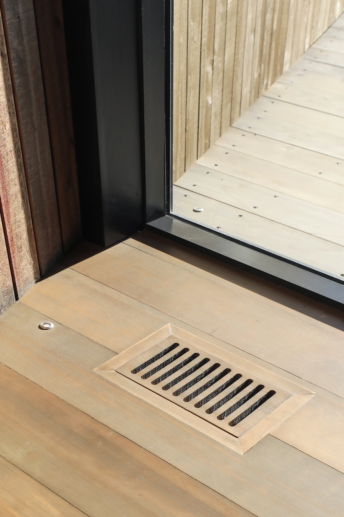 Detail shot of HVAC installation, flooring and modern Marvin windows of St. Croix Homestead in New Brunswick