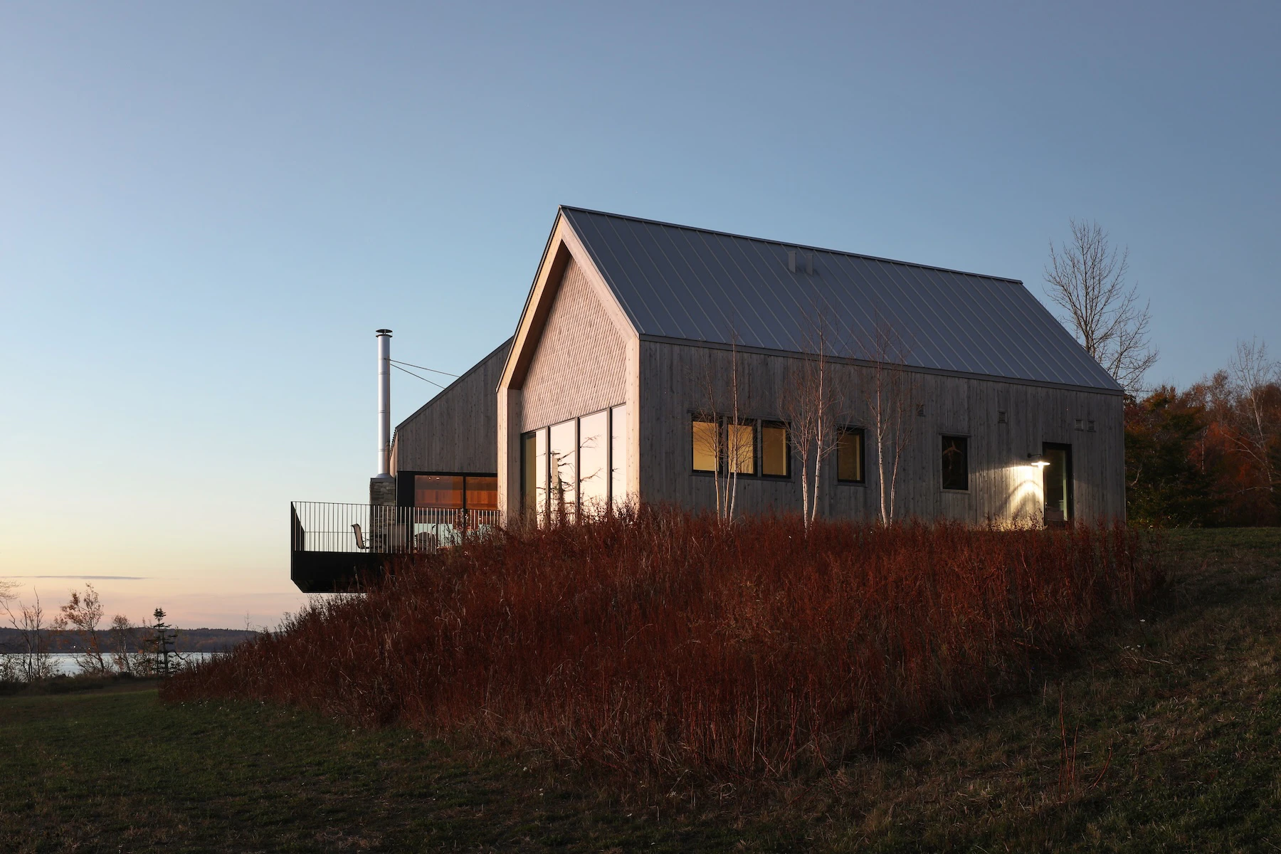 Elevated view of Rivers Edge Homestead against a twilight sky.