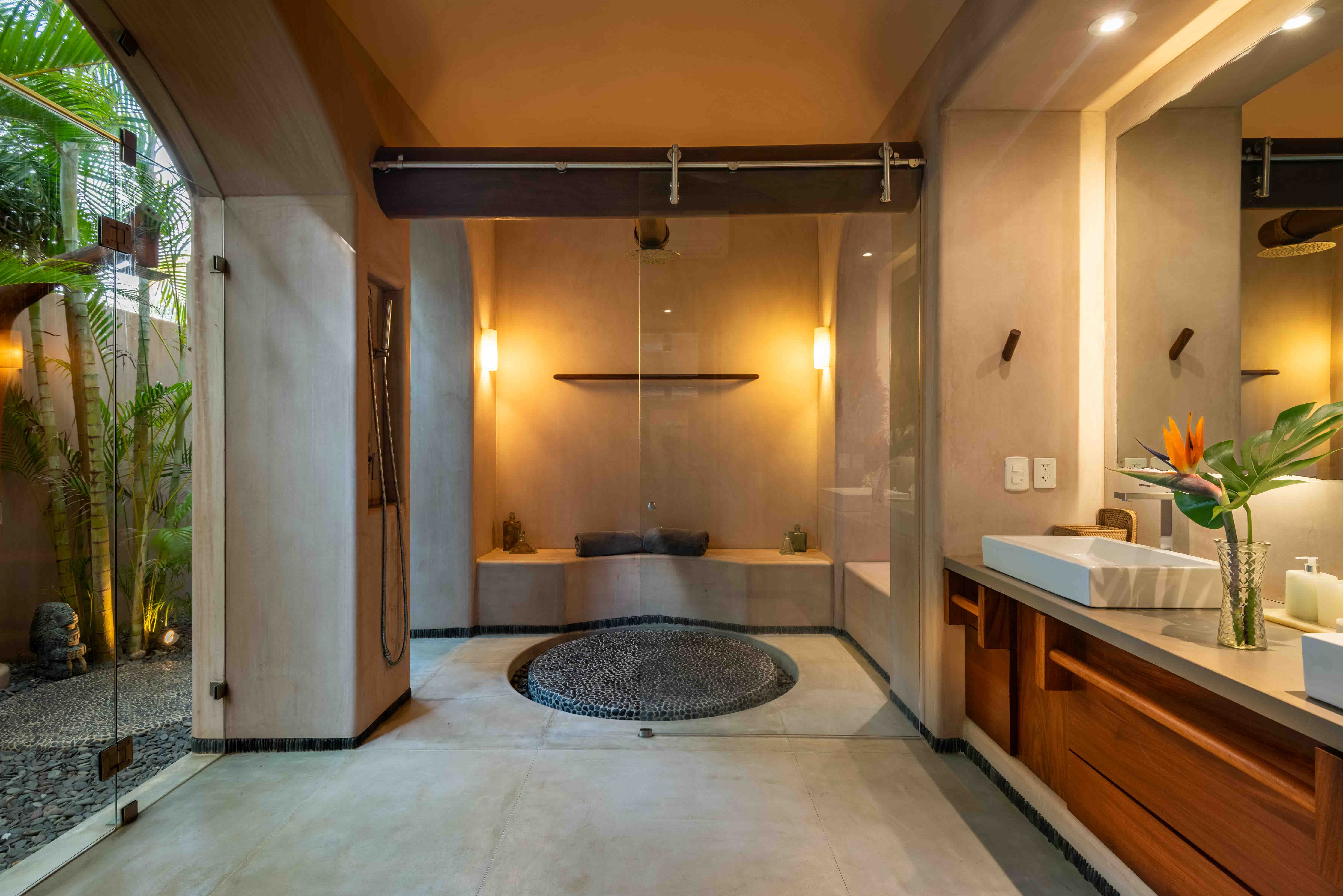 Contemporary bathroom with natural materials inside a beachfront house designed by Zozaya Arquitectos