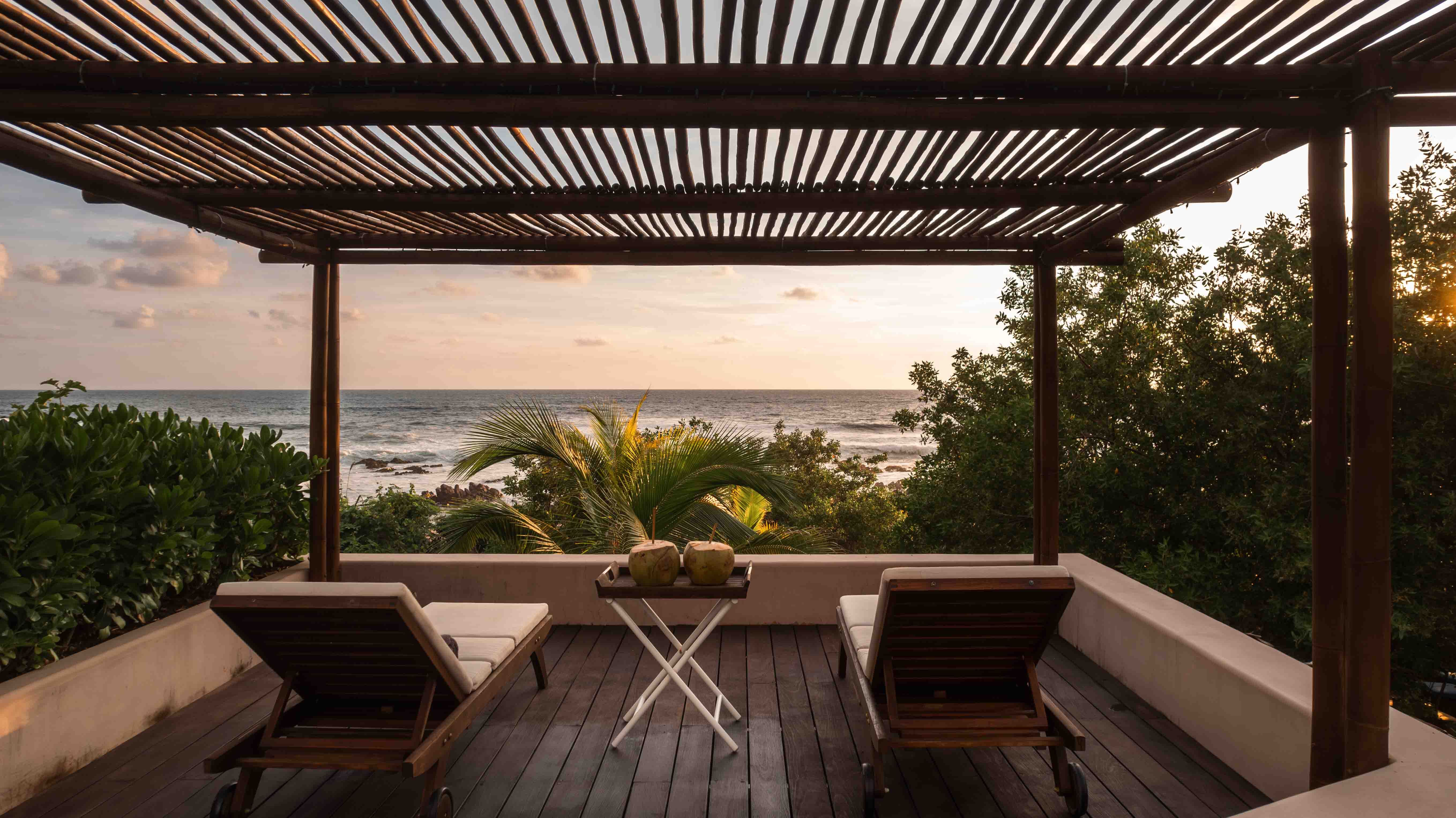 Outdoor terrace of a contemporary beachfront house overlooking the Pacific