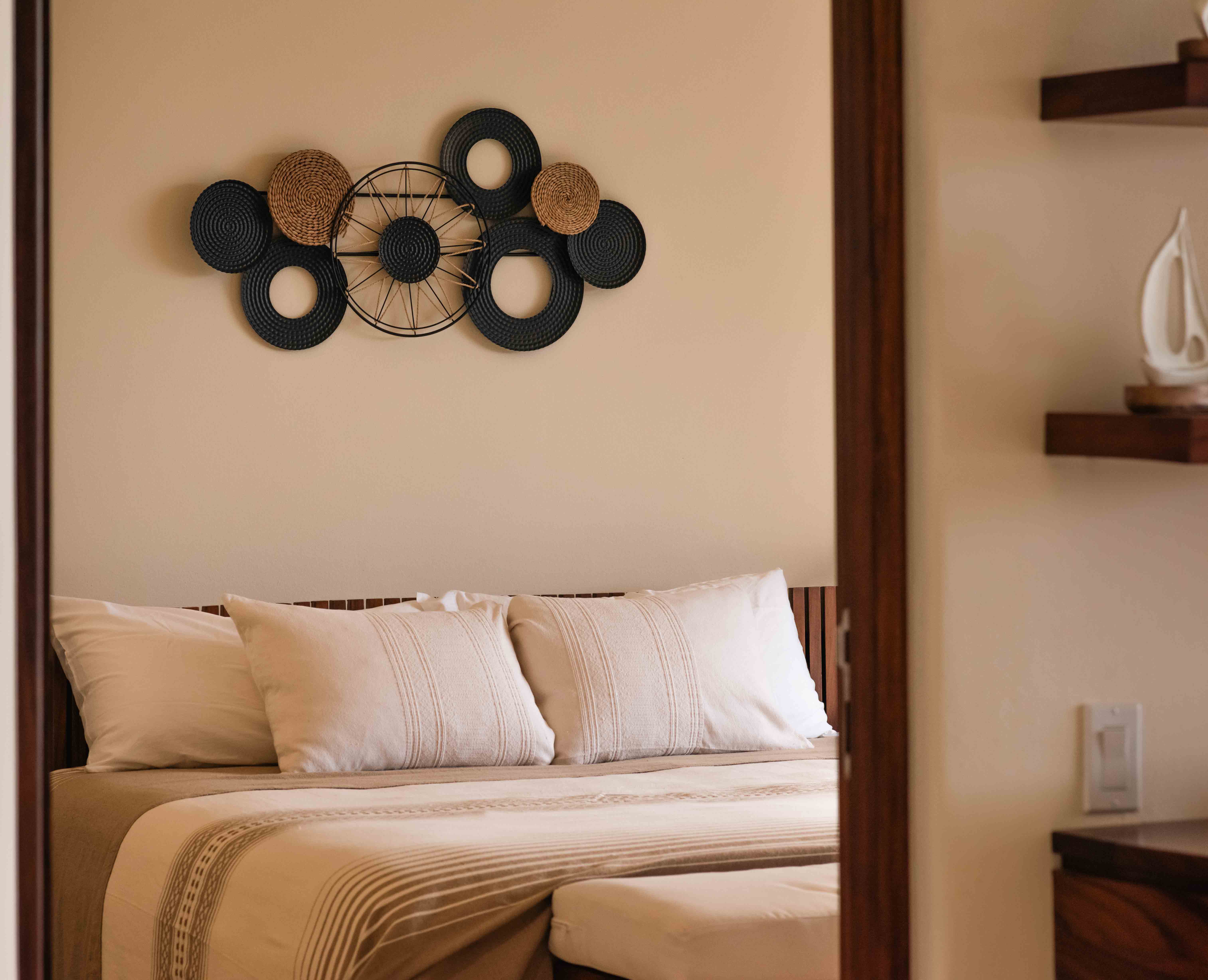 Detail of bed, pillows and wooden frame in Armadillo bedroom in Zihuatanejo