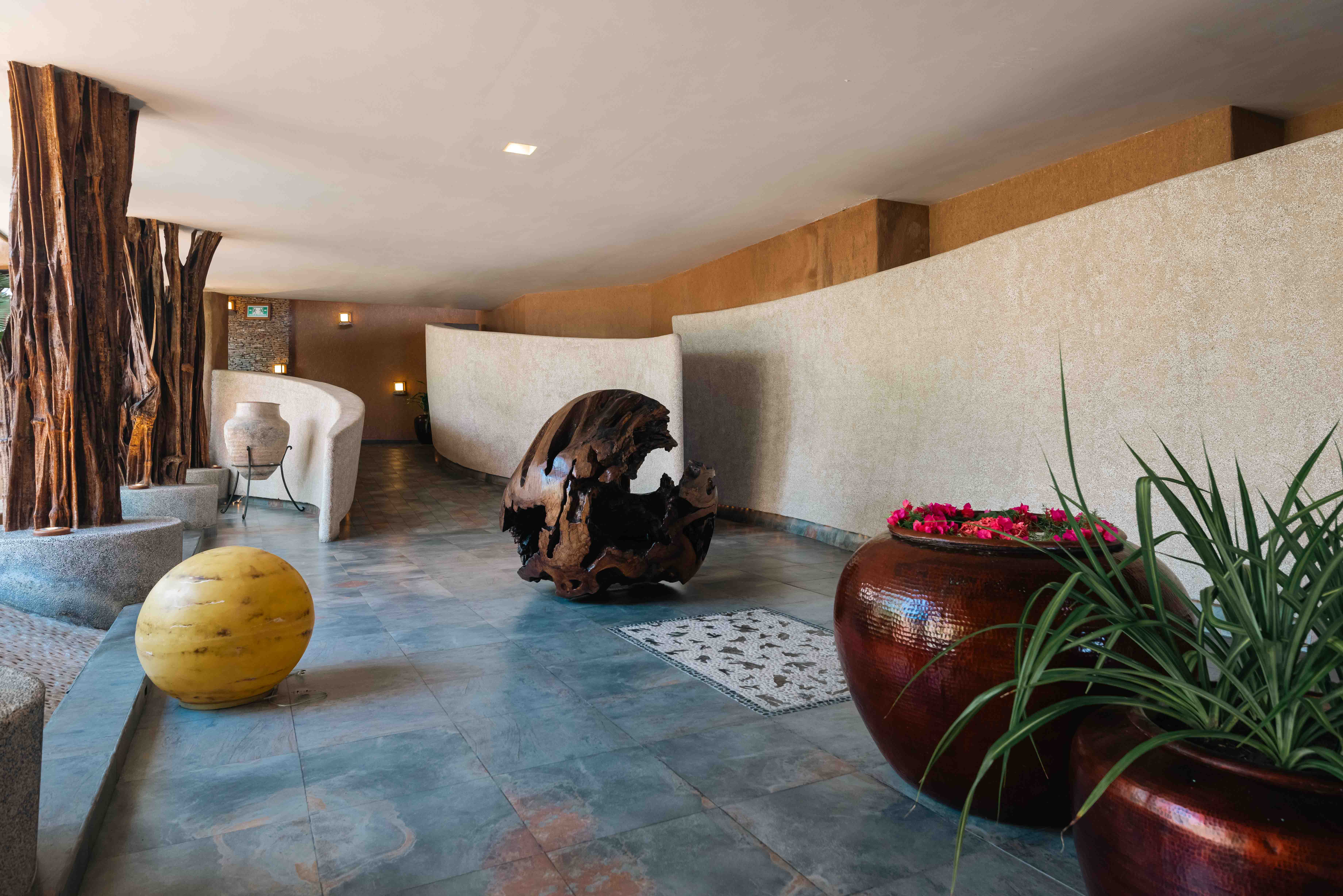 La Casa Que Canta hotel lobby entrance with artwork, marble floor and modern lighting in Zihuatanejo