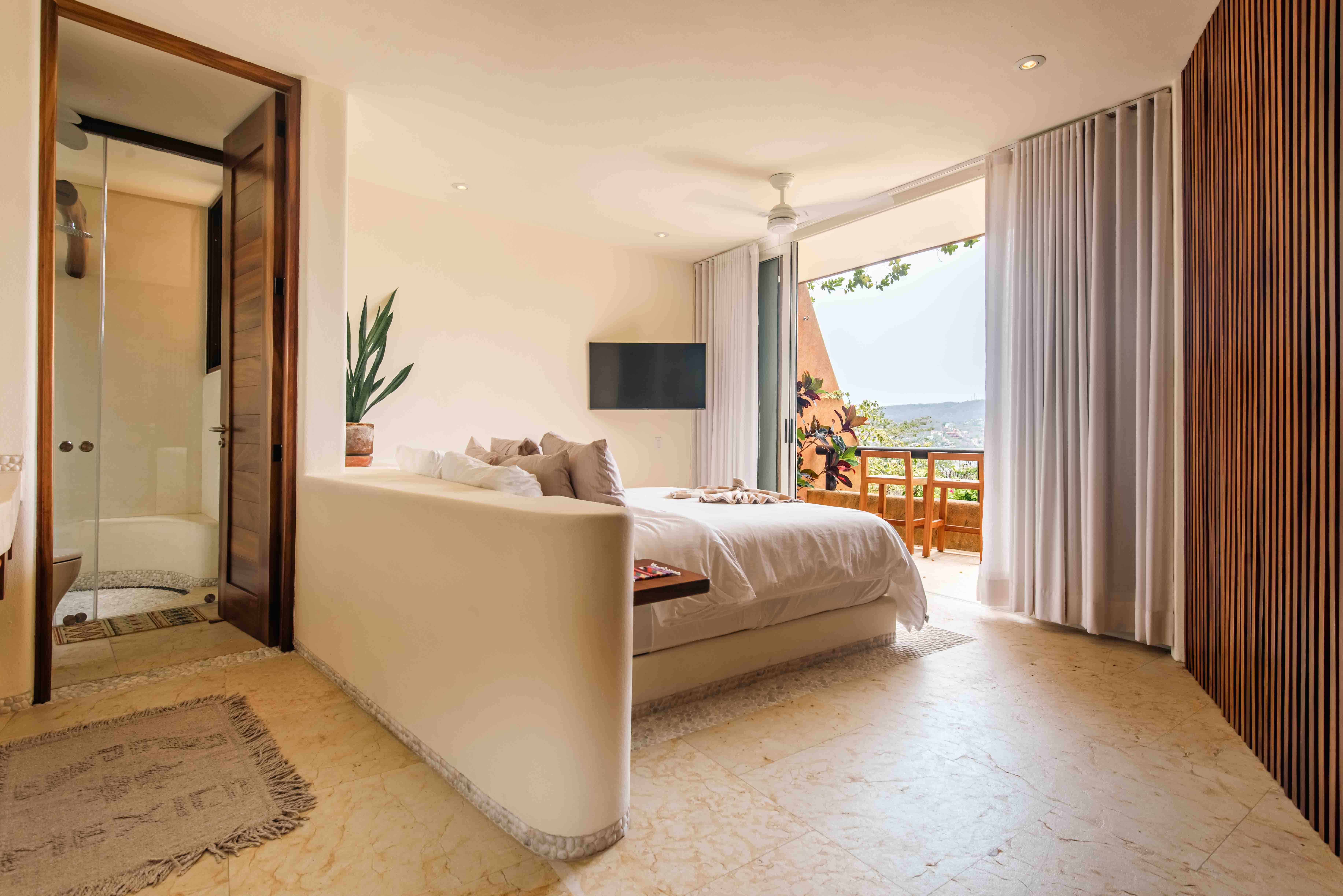 Bedroom with ocean view inside Armadillo luxury residence in Zihuatanejo