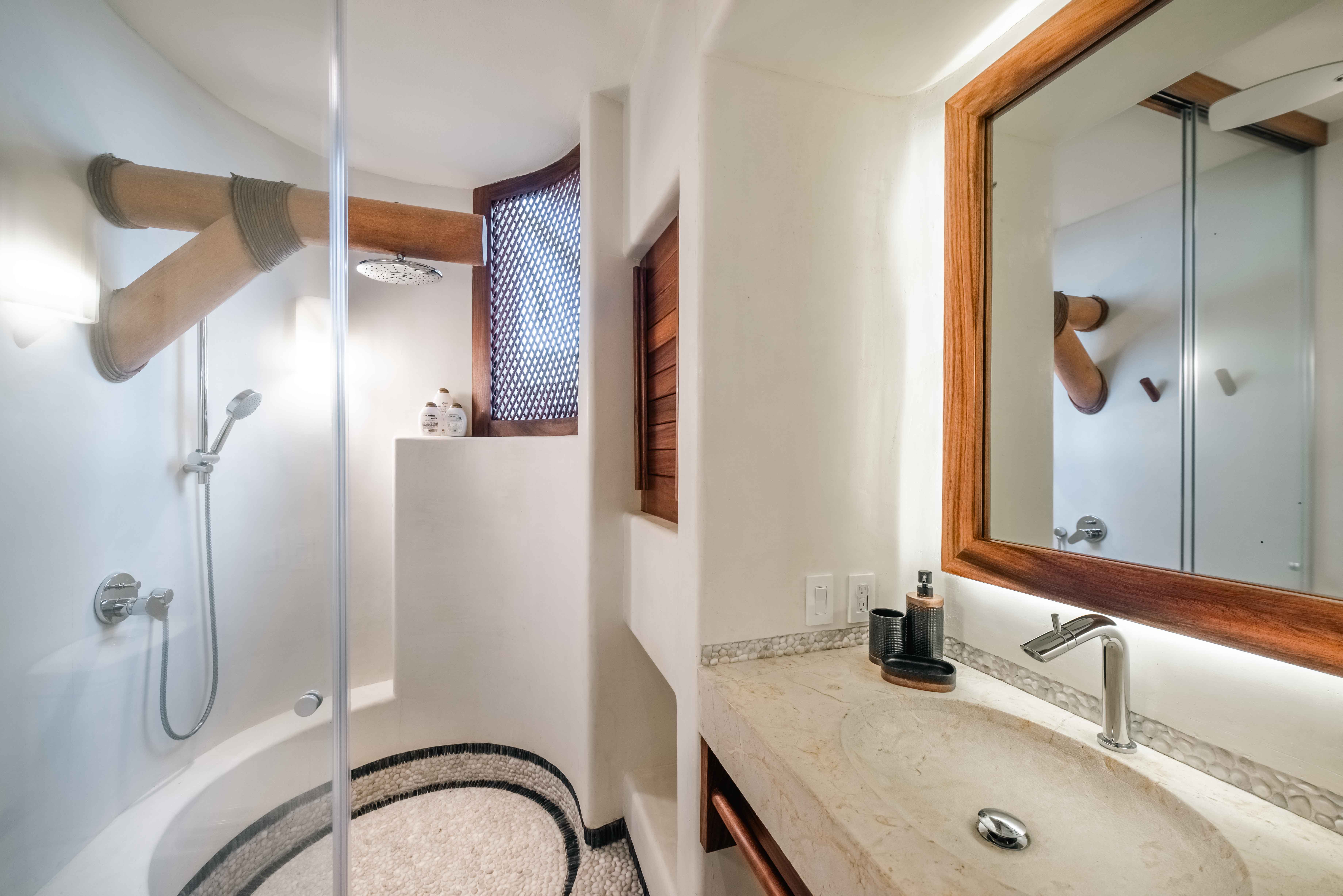 High-end bathroom with stone, wood and architectural details in Mexico