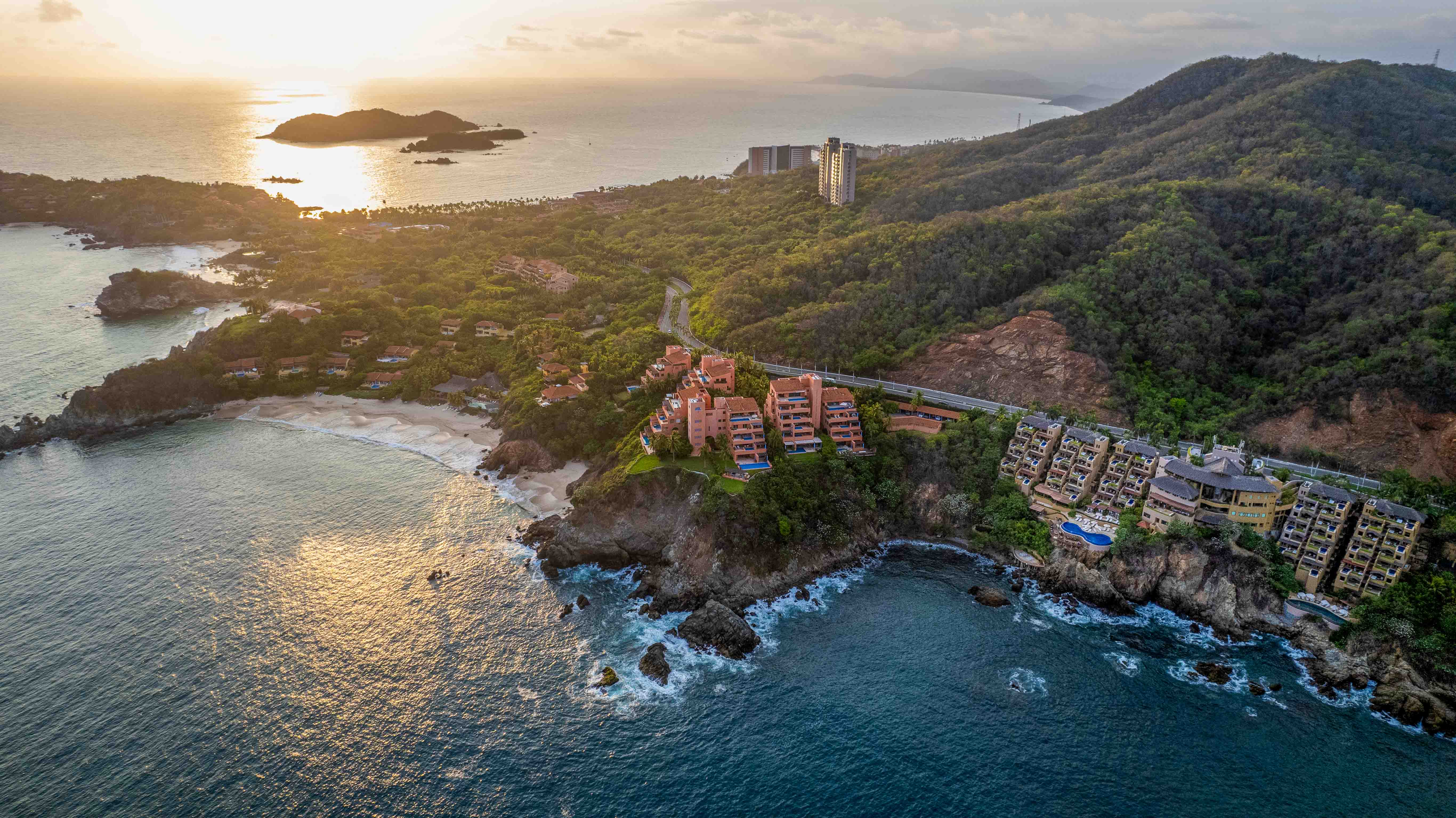 : Panoramic aerial view of Cala de Mar Ixtapa coastline, islands and mountains at sunset