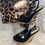 Thumbnail: Black and gold wedge woman shoe size 6