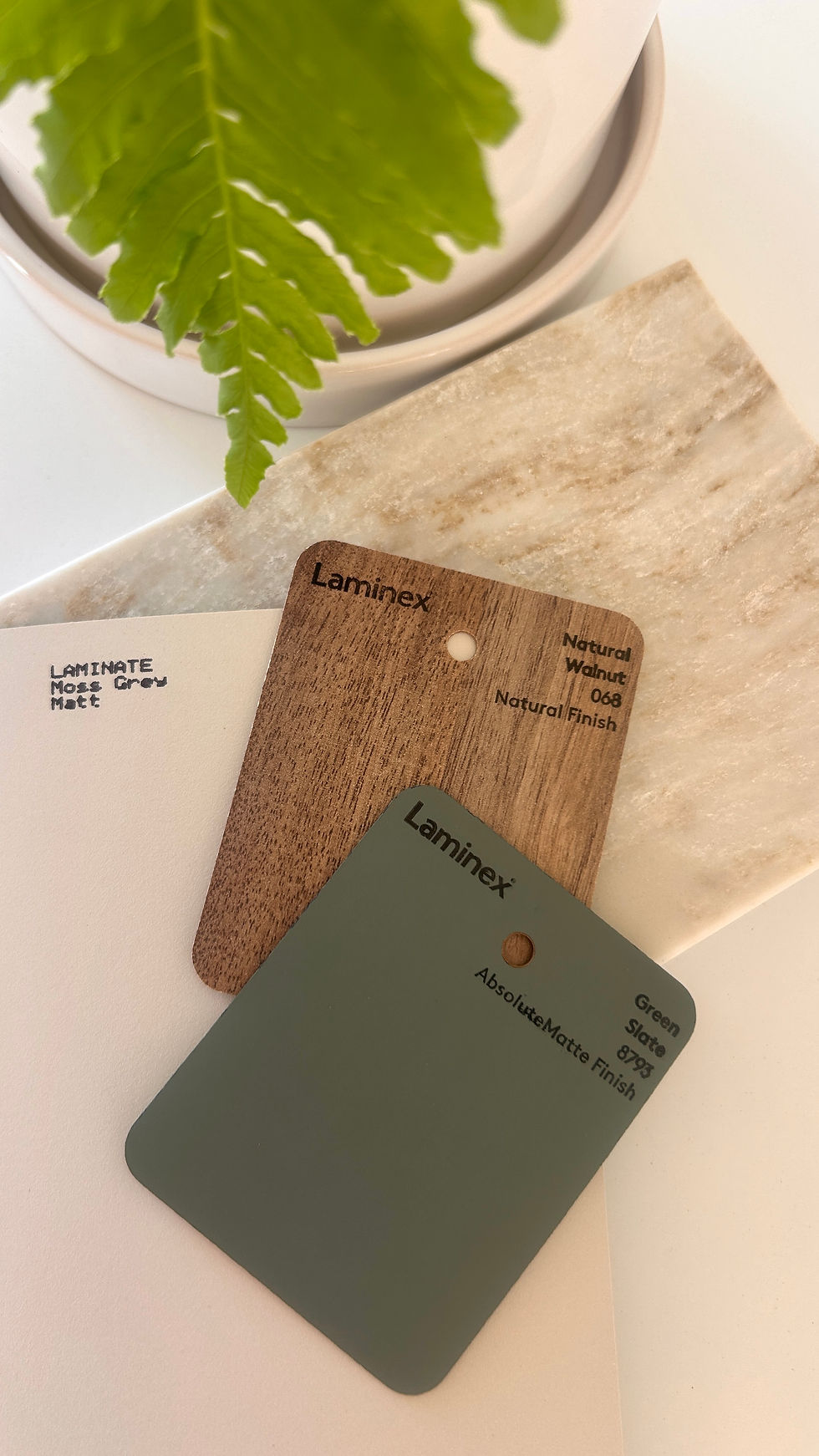 Laminex cabinetry colour and timber samples with a stone benchtop selection.