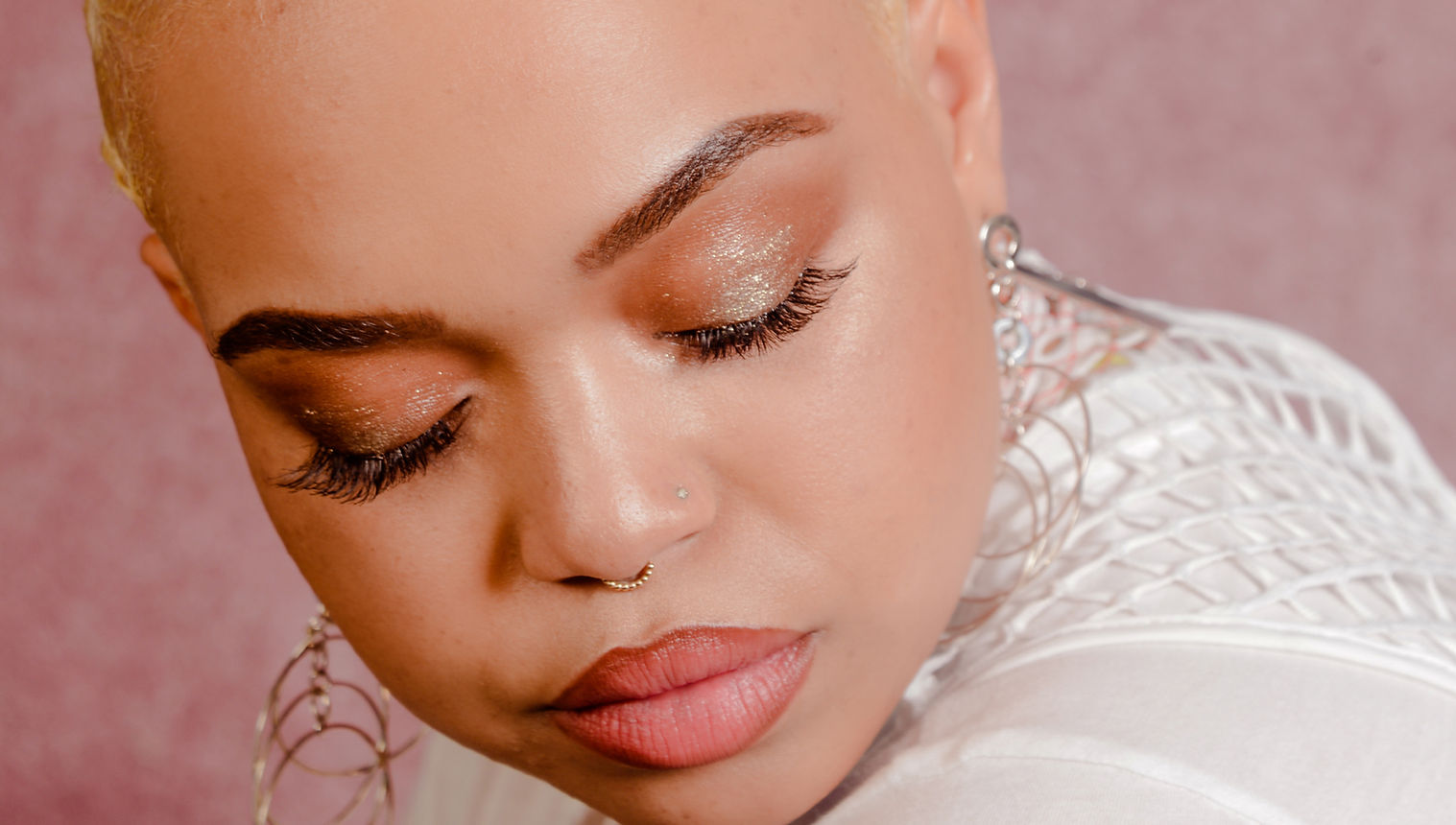 Close up of woman with glittery eyeshadow and glamorous makeup