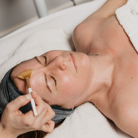 A customer laying down in the treatment room getting a medi peel
