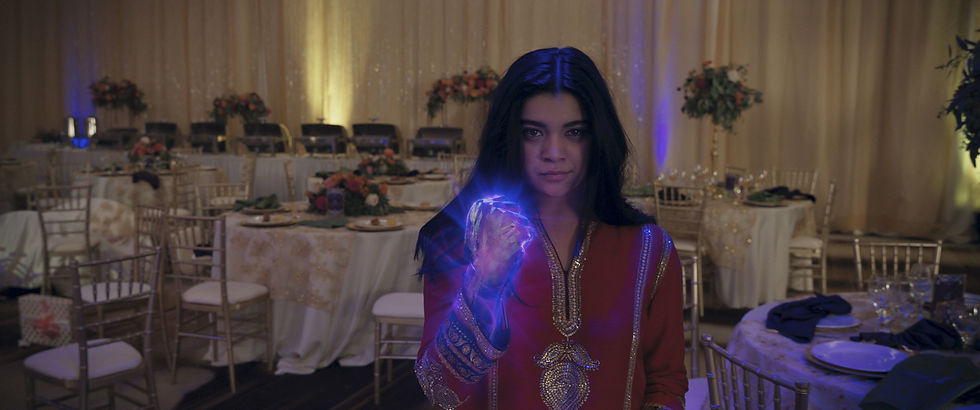 Iman Vellani as Kamala Khan, Ms. Marvel feeling the hard light glow.