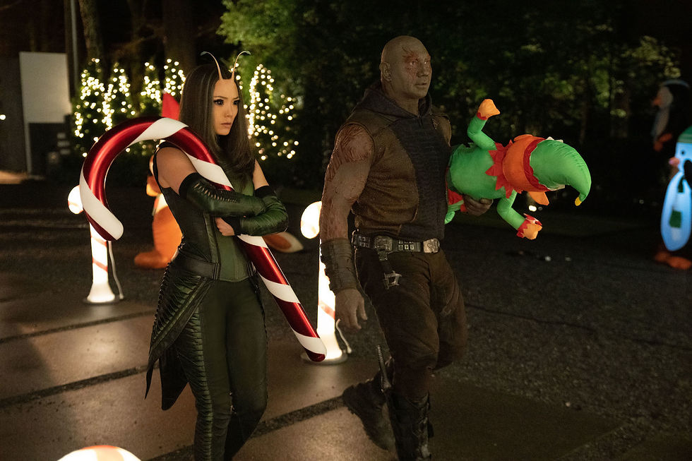 Drax and Mantis carrying Christmas decoration in The Guardians of the Galaxy Holiday Special.
