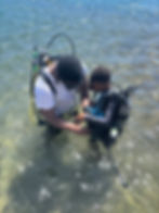 Young boy trying scuba diving for the first time on World Ocean Day, Saba
