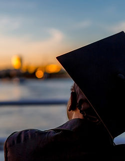 graduate watching sunset.jpg