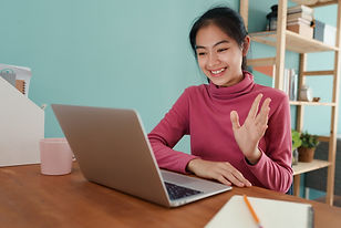 Asian Teen Waving on Zoom Call.jpg