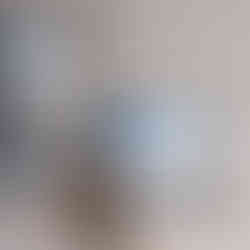 Stack of blue and white speckled Kovalska ceramic mugs