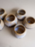 a bunch of beautiful cups