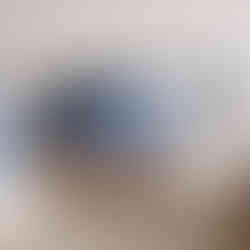 Blue speckled ceramic mug with handle