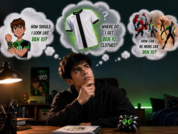 Person thinking about buying Ben 10 clothes, with thought bubbles showing Ben 10 outfits and aliens.