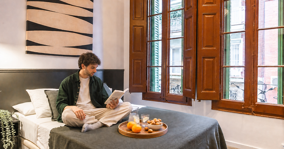 Person reading in a bright Haaus room in Barcelona.