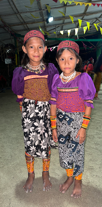 Two Guna girls smiling in San Blas, Panama