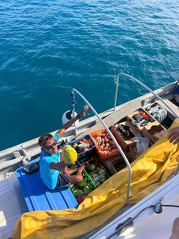 Local Guna providing vegetables to the boat.
