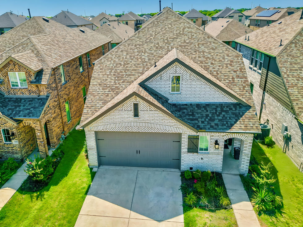 Rental property drone photography showing roof, yard, and community in Rockwall TX.