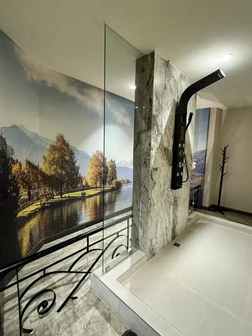 Glam's bathroom with a vibrant mural on the wall, creating an inviting atmosphere for relaxation