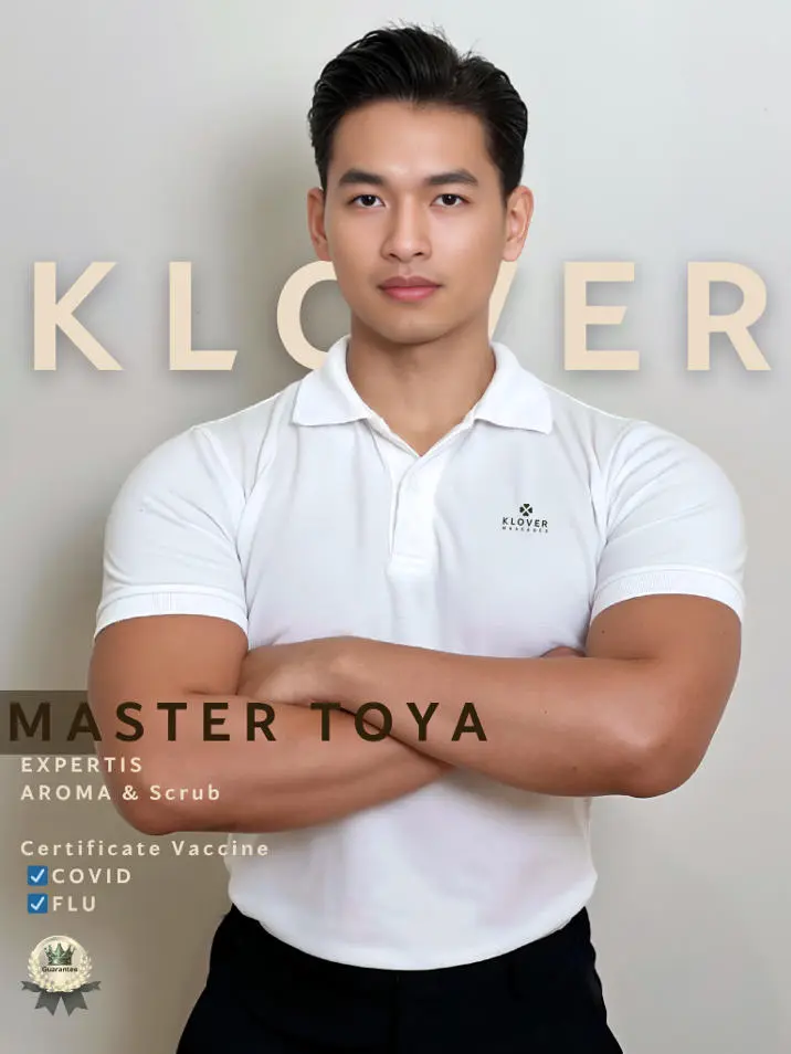 Master Toya from Klover gay massage Bangkok, posing with a muscular physique and charming smile