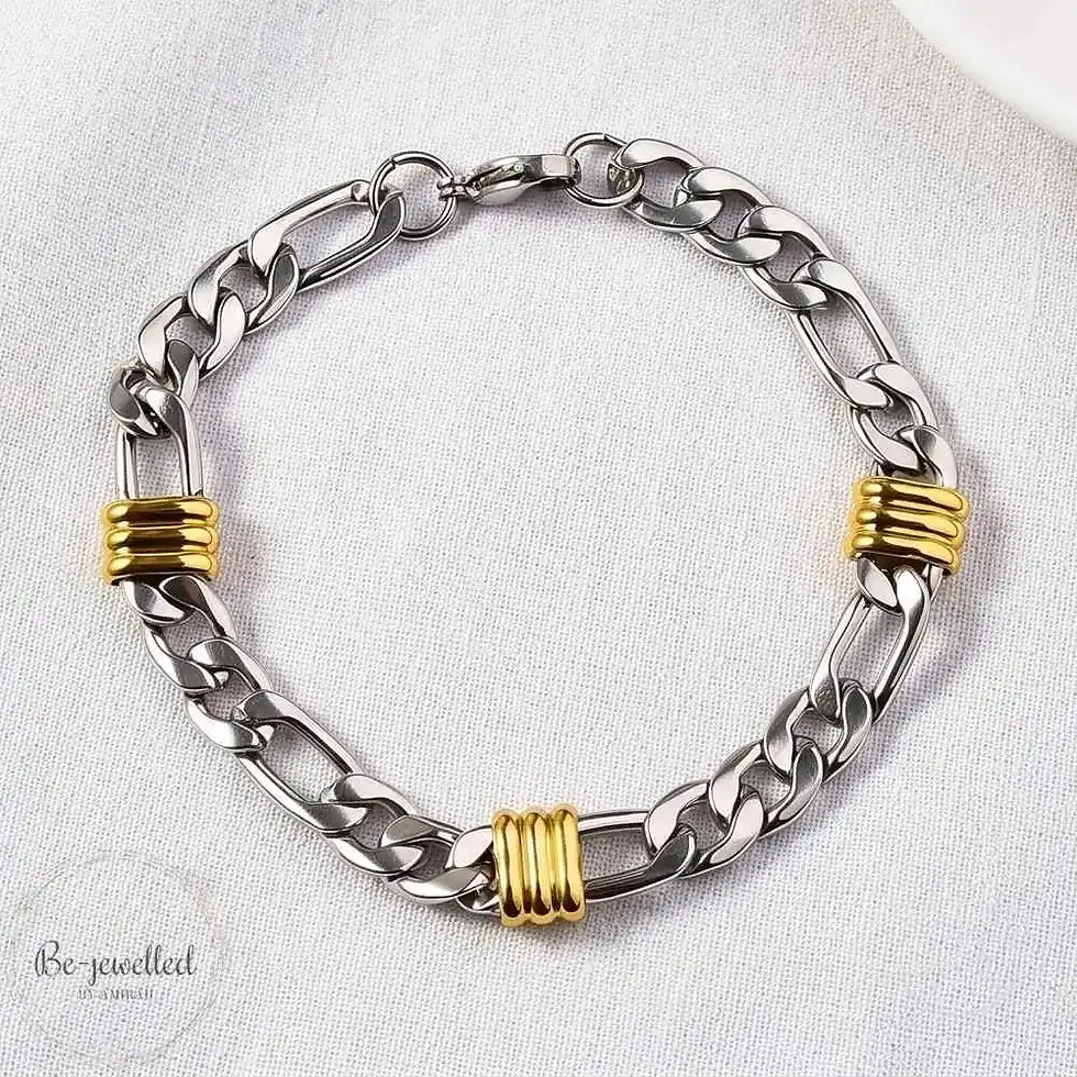 Thumbnail: Angled view of men’s stainless steel Cuban link bracelet with gold details
