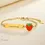 Thumbnail: Personalised gold strawberry name bracelet for kids