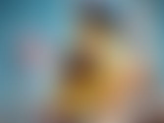 A French banana in a beret, holding a baguette in one hand and a French flag in the other.