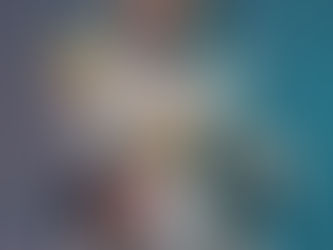 Cosplay cam model sitting on a gaming chair, holding a banana, playful style - live cam sites review