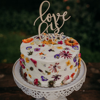 A wedding cake decorated with dried flowers at this Tucson area wedding