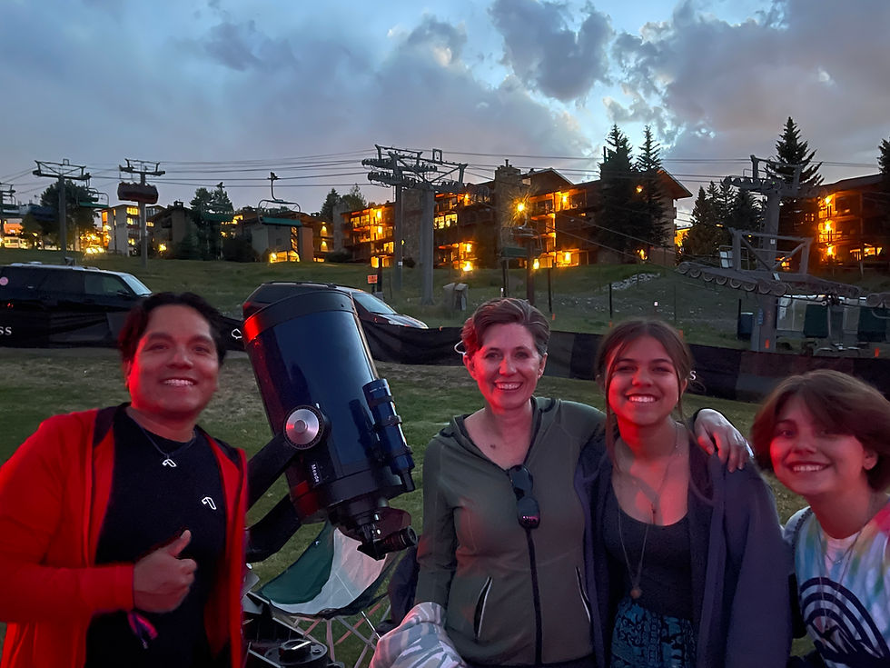 A family enjoying an astronomy night out with AstroTours and Large Telescopes