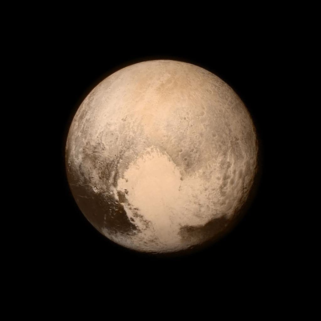 New Horizons globe of Pluto from July 2015 with bright heart-shaped terrain, combining imaging and color data.