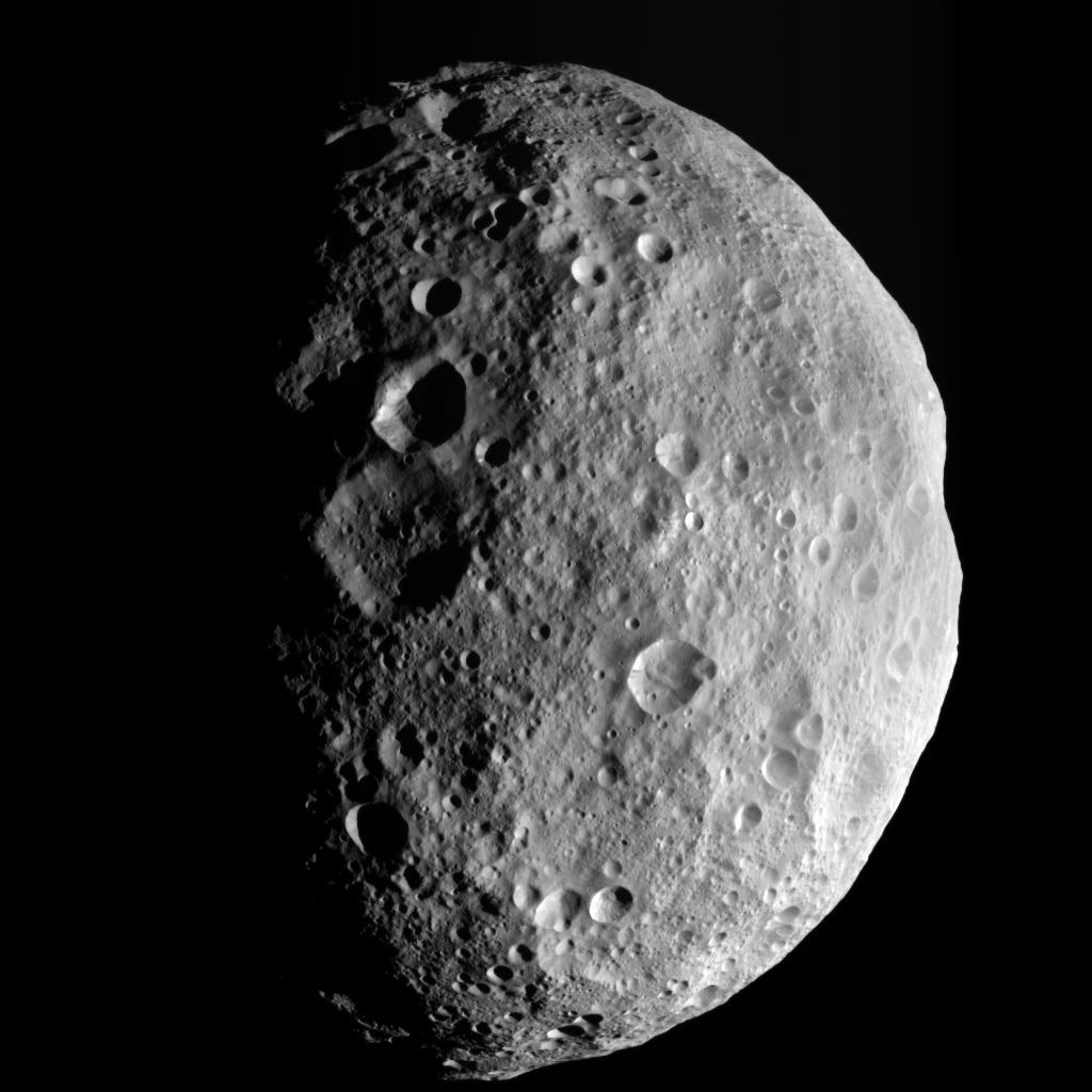Dawn spacecraft view of Vesta’s cratered northern terrain; Vesta is one member of the asteroid belt.