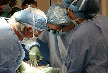 Doctors Operating on Patient