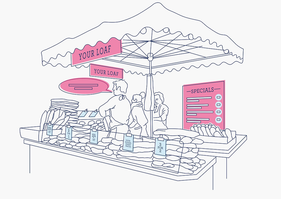 Staff working on market stall, selling bread produce