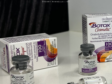 Botox vials and boxes on a white surface. Package text visible. Black background with Media Aesthetics logo. Clean and professional setting.