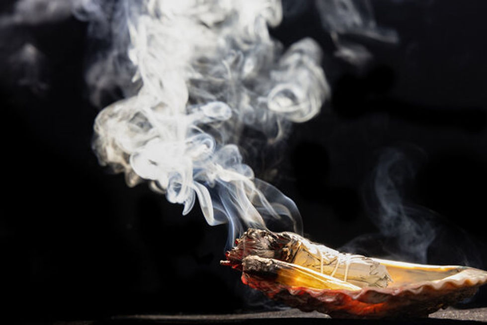 burning sage and Palo Santo, spiritual cleansing tools and techniques using smoke