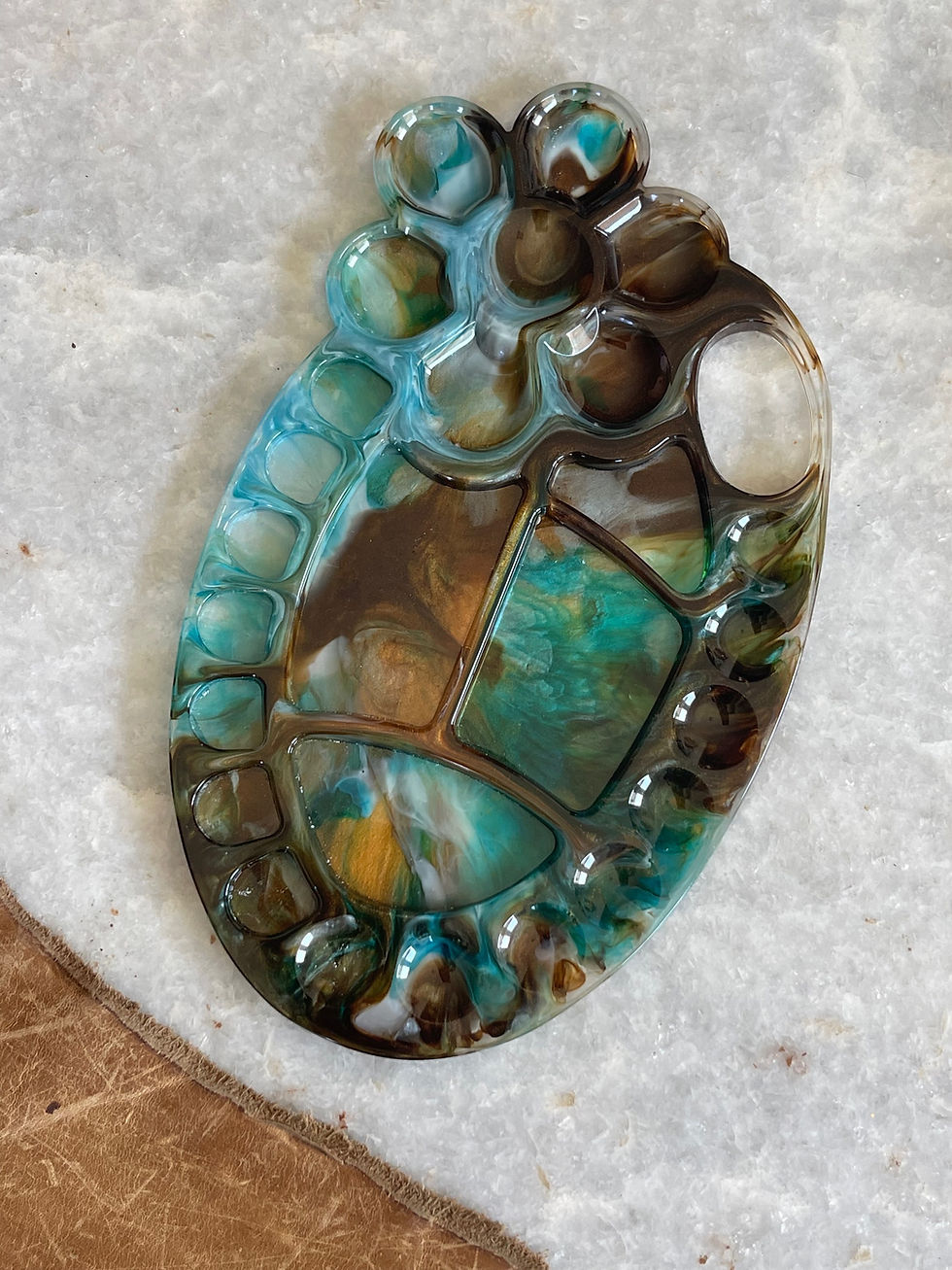 Thumbnail: Floral shaped painters pallet in blues, white and browns 