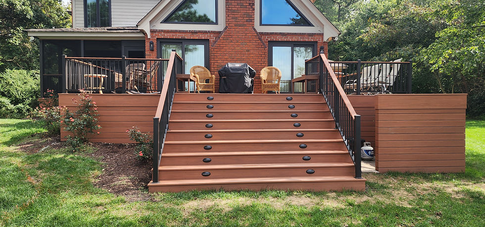 Custom deck designed and built by us, featuring Timber Tech composite decking and integrated rail lighting.