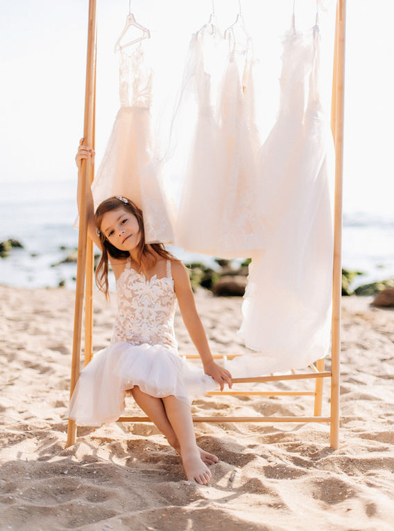 white flower girl dress with beaded straps, floral embroidery and flare skirt