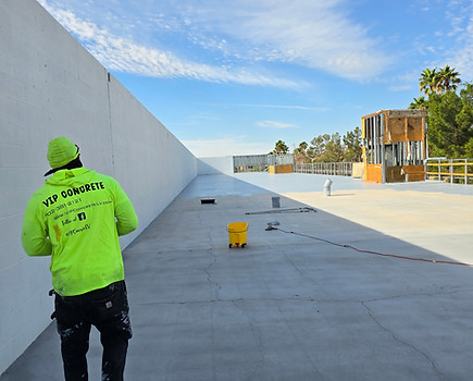 Example of VIP Concrete in the Las Vegas area, in actions on site in a yellow jacket, for epoxy flooring systems, restaurants and food services from example.