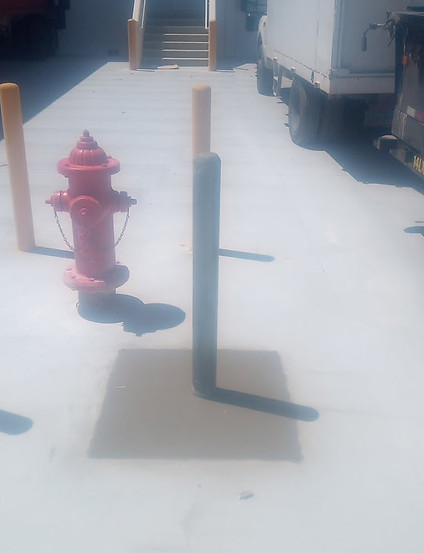 Commercial Bollards & Safety Installations  traffic-control safety bollards for vehicle flow, pedestiran walkways example around a fire hydrant, loading areas and ADA access in the Las Vegas area via VIP Concrete