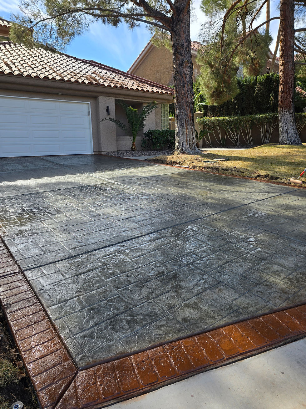 After photo of newly replaced stamped and colored concrete driveway installed by VIP Concrete in Las Vegas, replacing old cracked concrete.